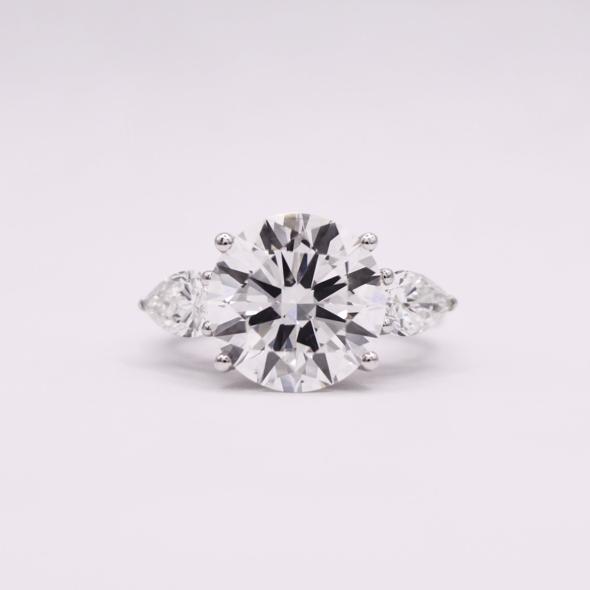 Trinity Hidden Halo Round/Pear Ring