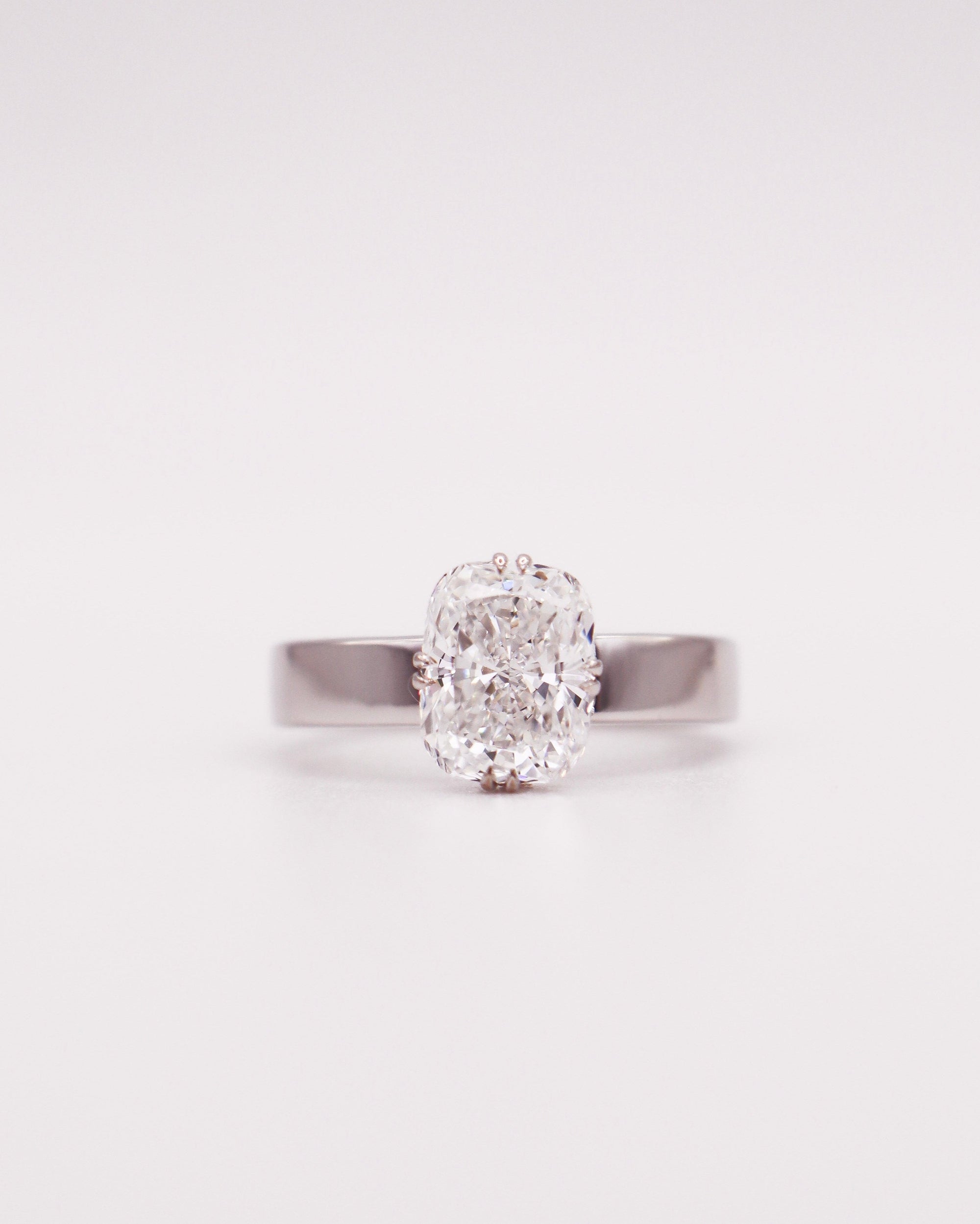Wide Band Celestial Hidden Halo Elongated Cushion Ring