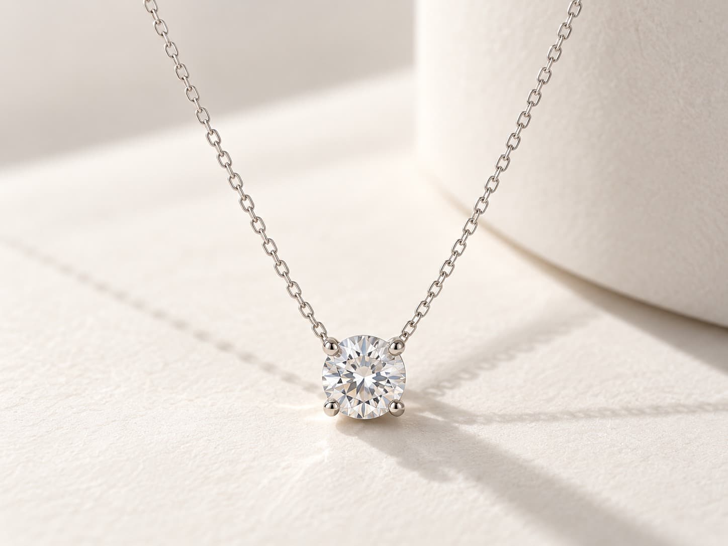Layered diamond pendant necklaces against skin
