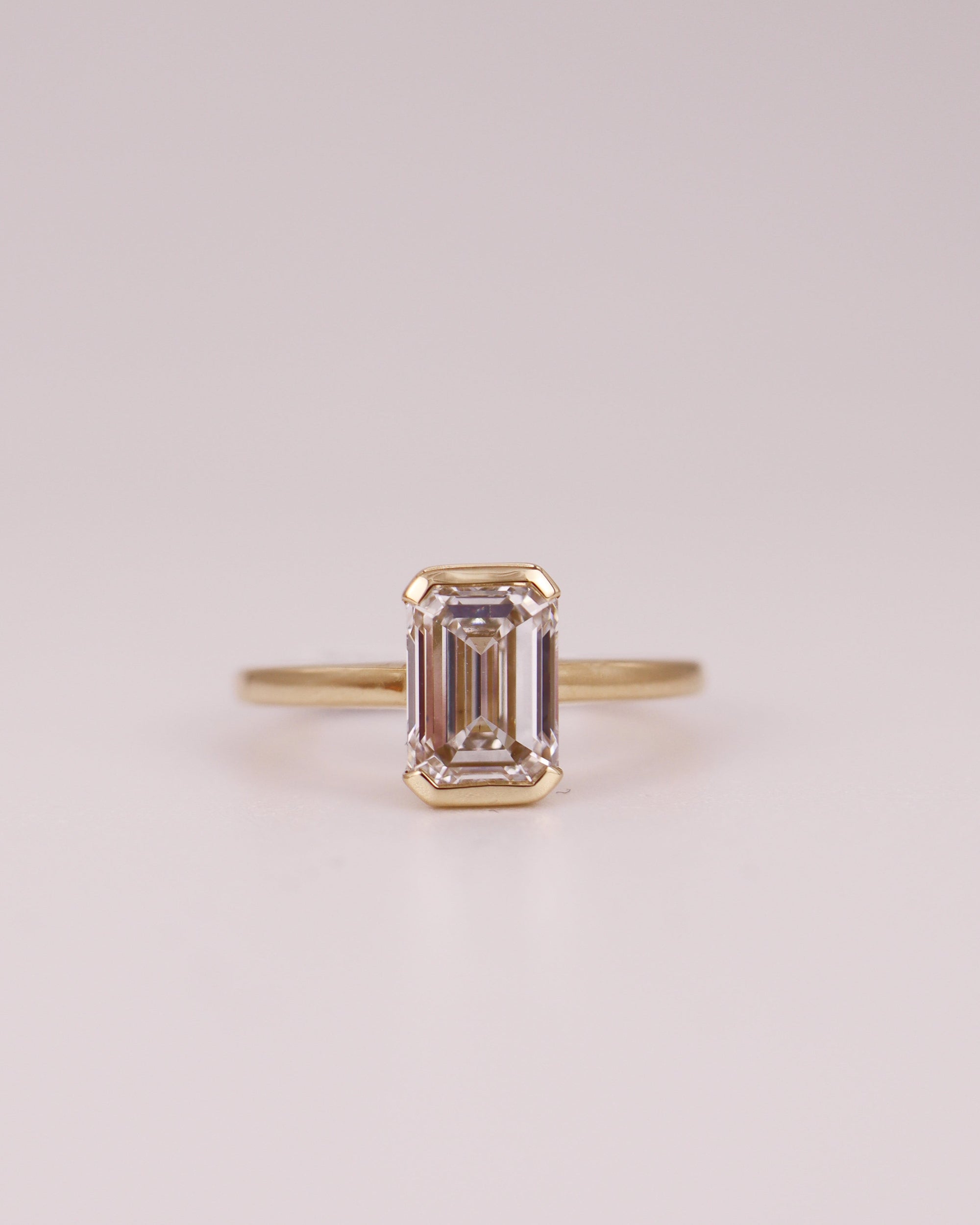 Half Eclipse Emerald Ring